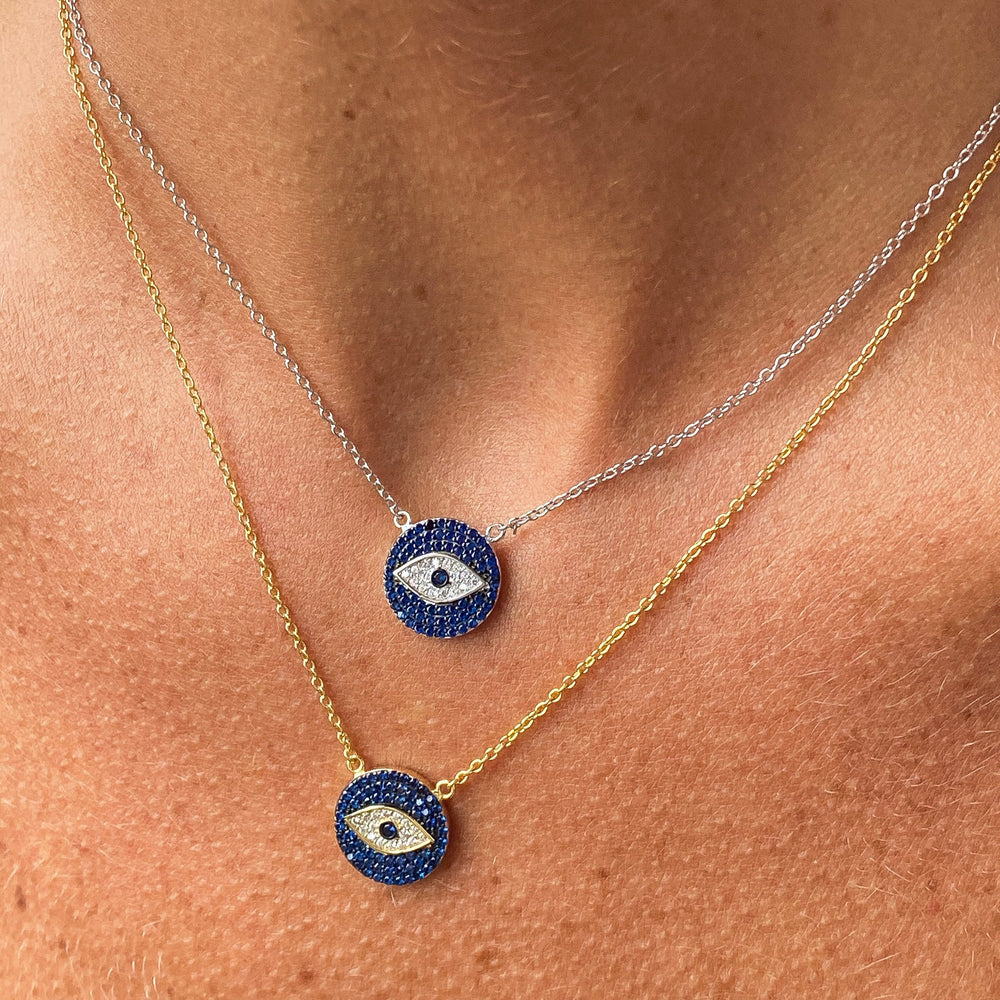 wearing the silver and gold evil eye disc necklaces