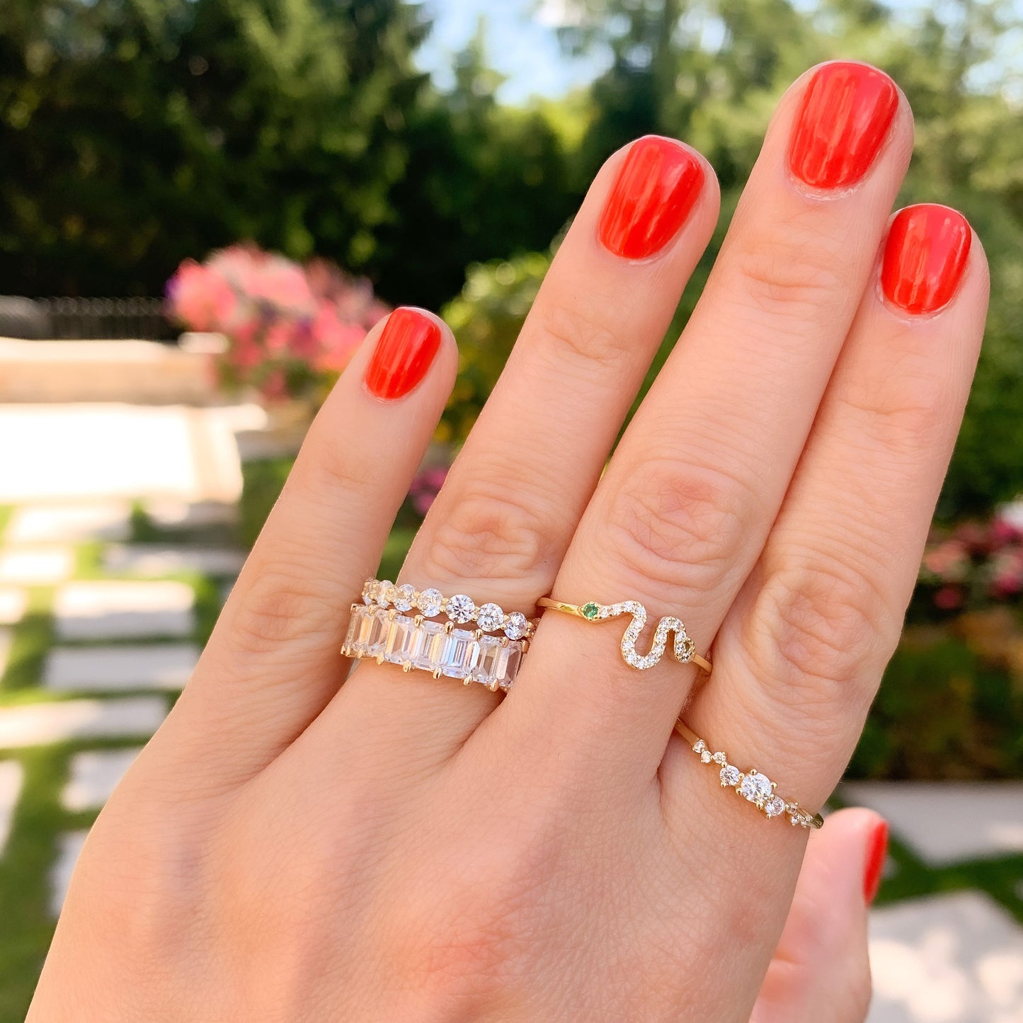 Alexandra Marks stacking the gold green eyed dainty snake ring from Alexandra marks jewelry