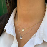 Wearing the silver and gold charm necklace from Alexandra Marks Jewelryu