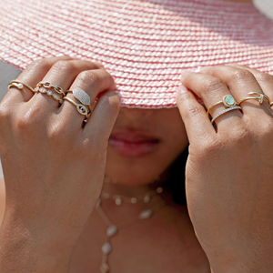 Stacking the thin gold nail ring from Alexandra Marks Jewelry