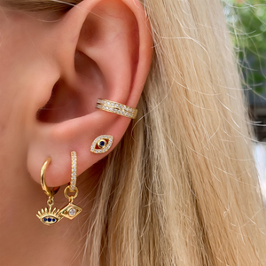 
            
                Load image into Gallery viewer, Alexandra Marks wearing a gold evil eye earring stack
            
        