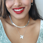 Wearing Alexandra Marks's Gardenia Cz Necklace worn with her silver herringbone chain necklace