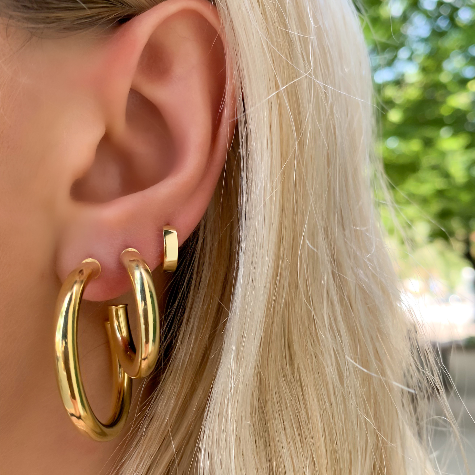 Stacking the plain gold huggie hoops from Alexandra Marks Jewelry