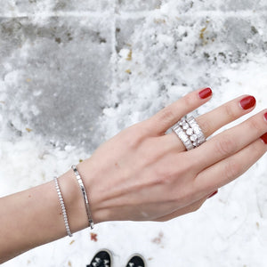 
            
                Load image into Gallery viewer, Alexandra Marks stacking two of the baguette cz eternity bands with a round eternity band
            
        