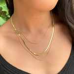 Wearing the layered gold fashion herringbone chain necklace from Alexandra Marks Jewelry