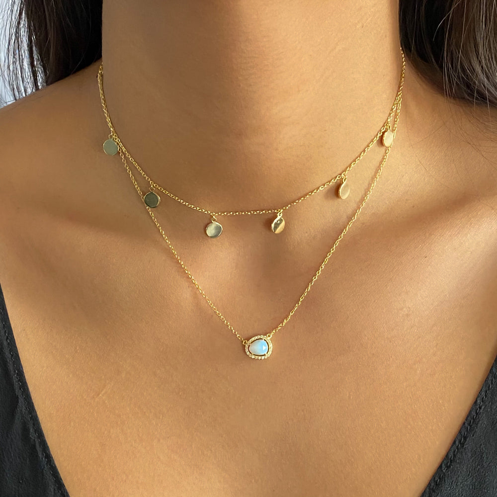 Wearing the gold opal free form necklace from Alexandra Marks Jewelry