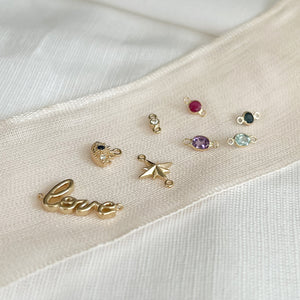 Gold and gemstone bracelet charms for Alexandra's Permanent jewelrt collection. 