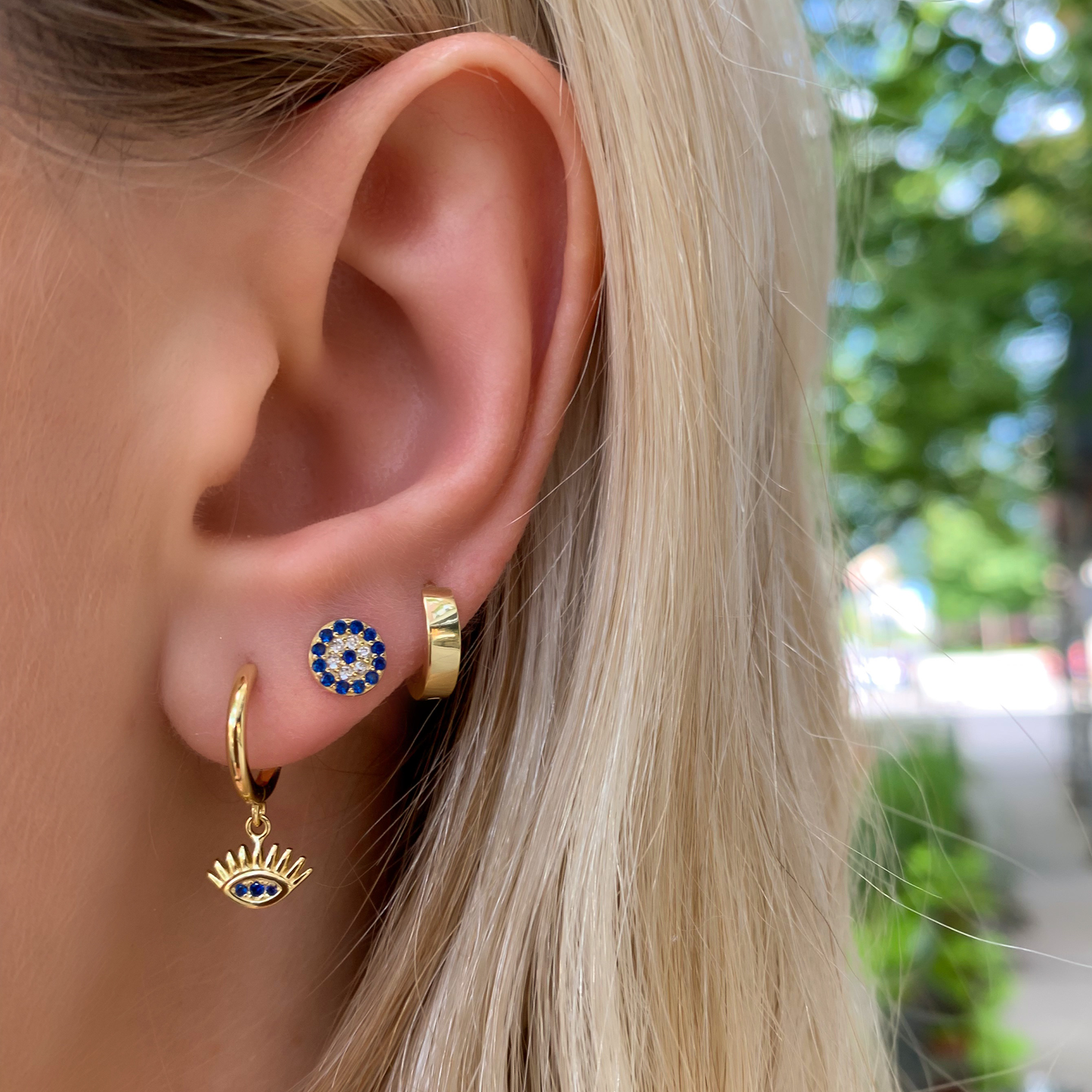 Wearing the tiny small huggie hoop earrings in gold from Alexandra Marks Jewelry