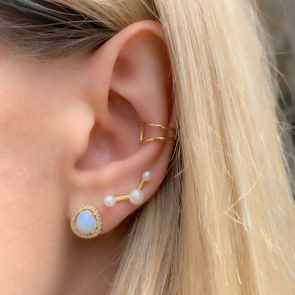 Stacking the gold opal stud earrings from Alexandra Marks Jewelry